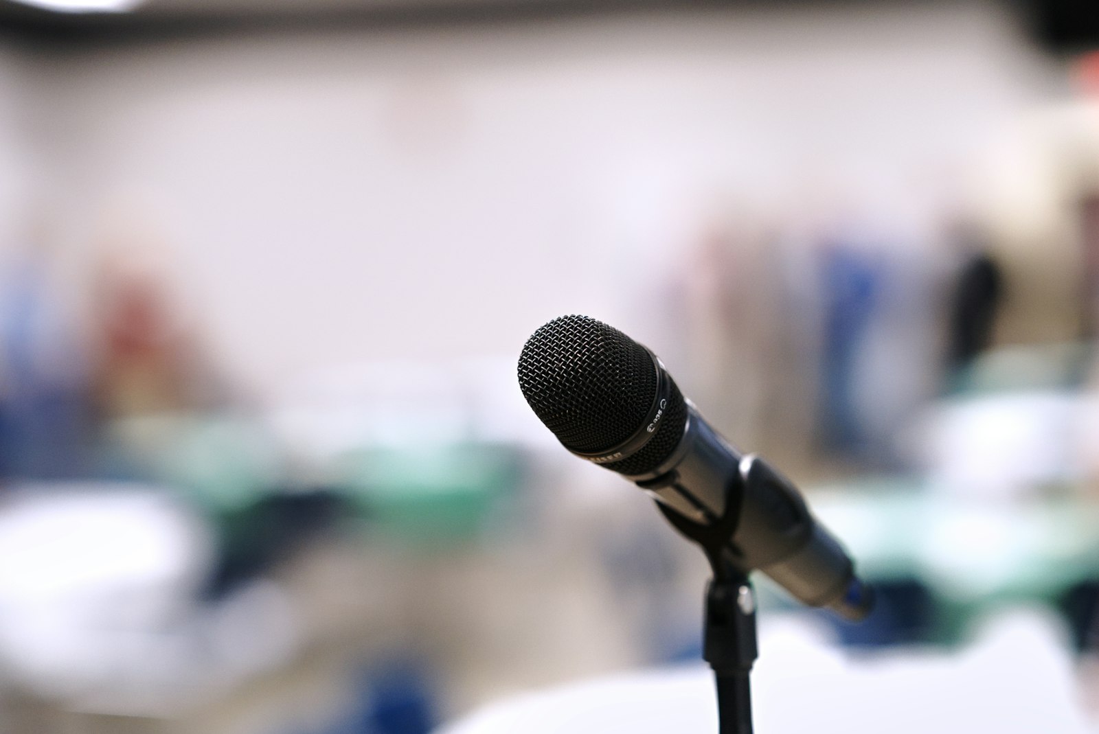 Microphone on a stand in a conference room.